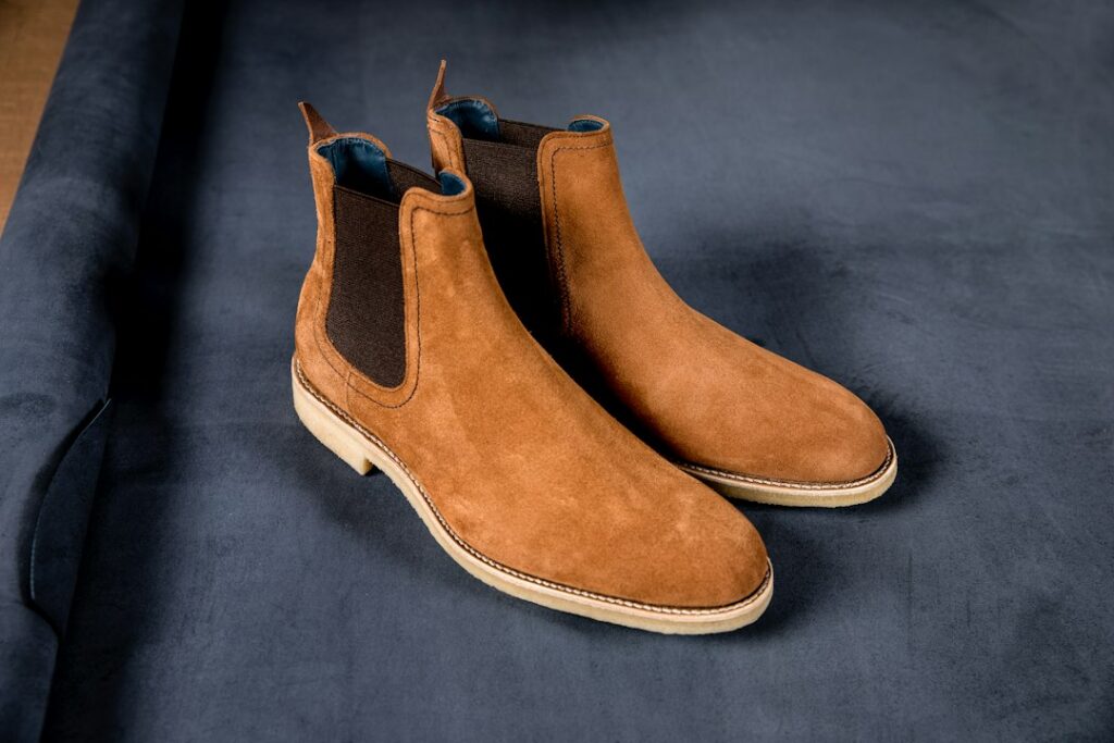 Chelsea boots and Oxford shoes shown side by side