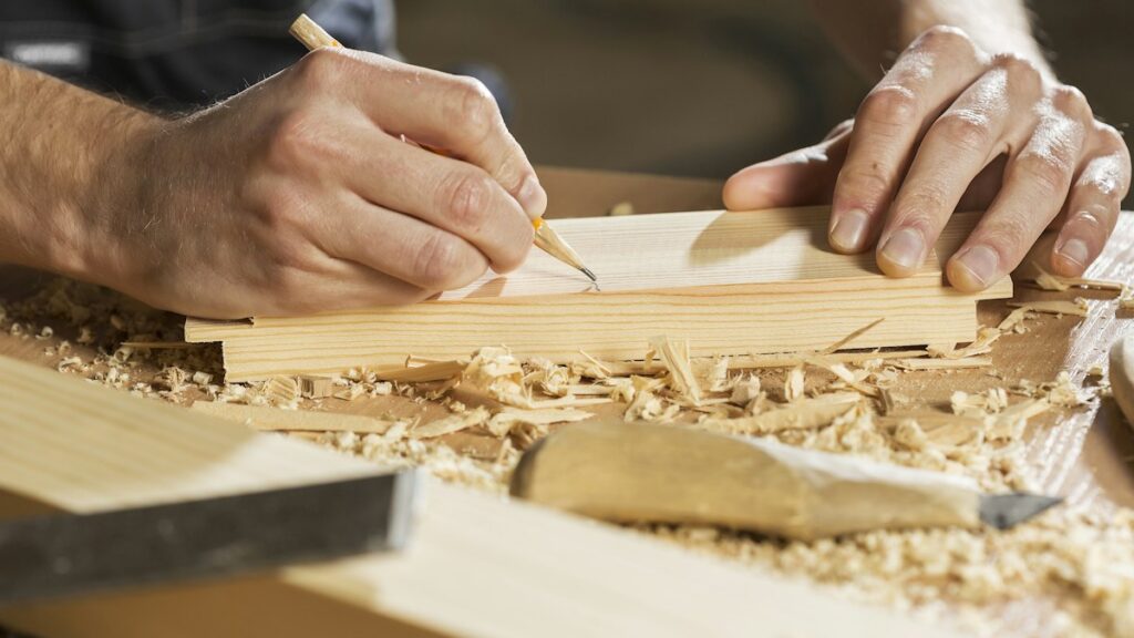 Carpenter working on a small project in a workshop