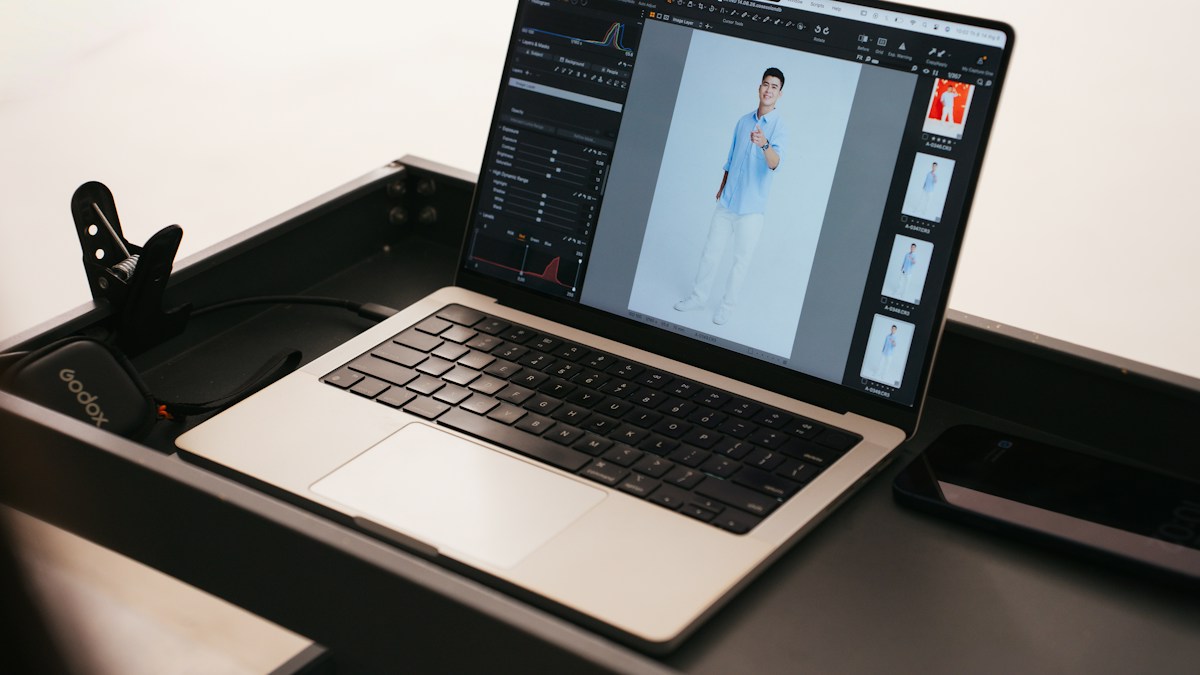 Professional working on a client eBook design on a laptop