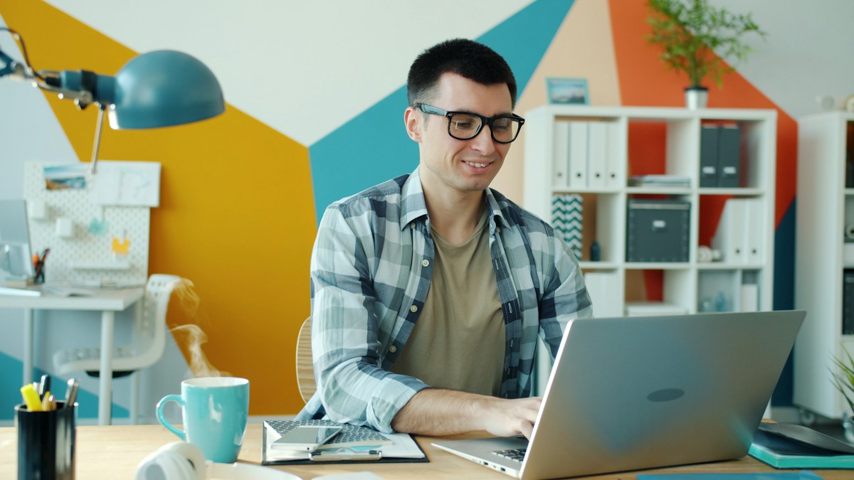 Professional working through a client project on a laptop