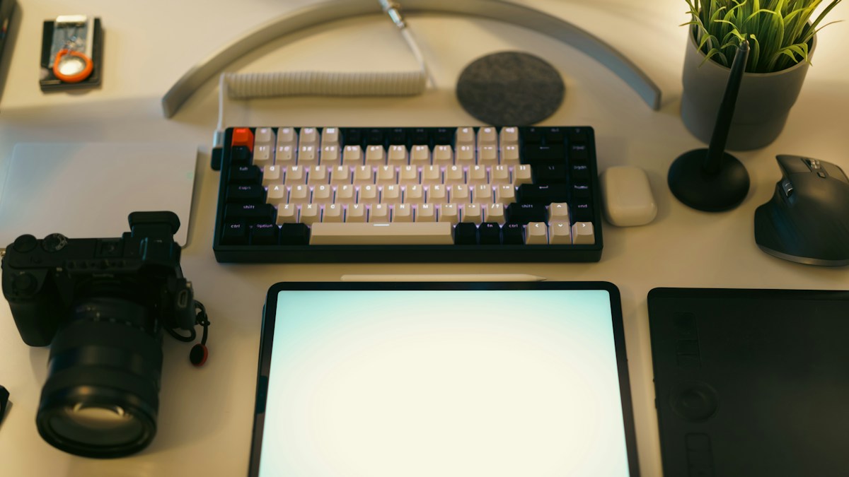 Digital publishing workspace with computer and design tablet