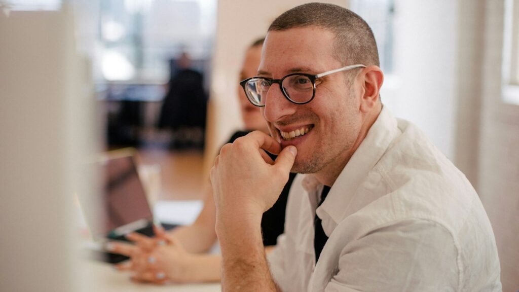 Person in an office reflecting on workplace feedback