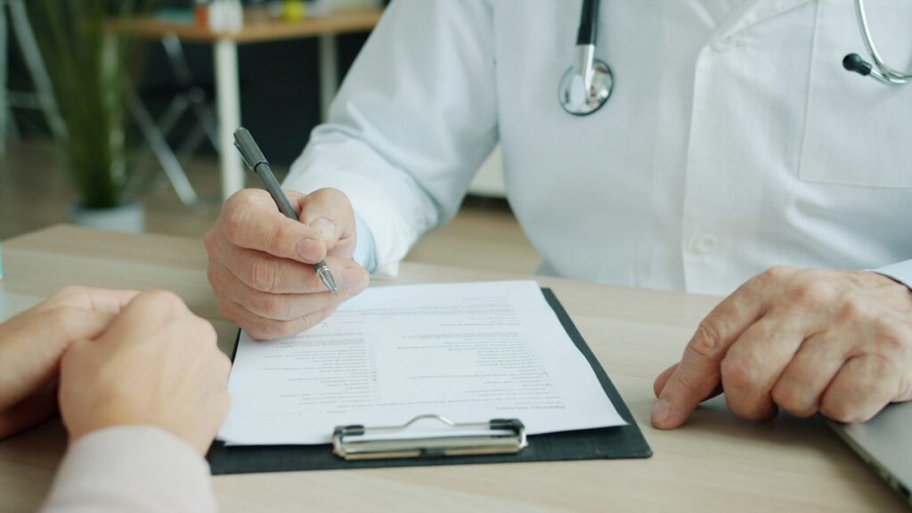 Clinician reviewing health information during an appointment