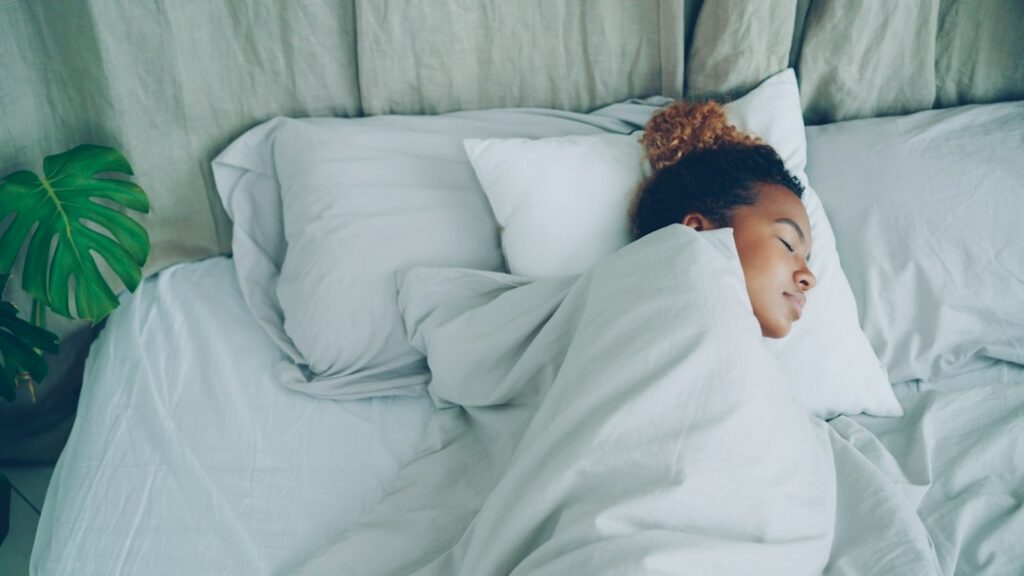Man sleeping in bed during the night
