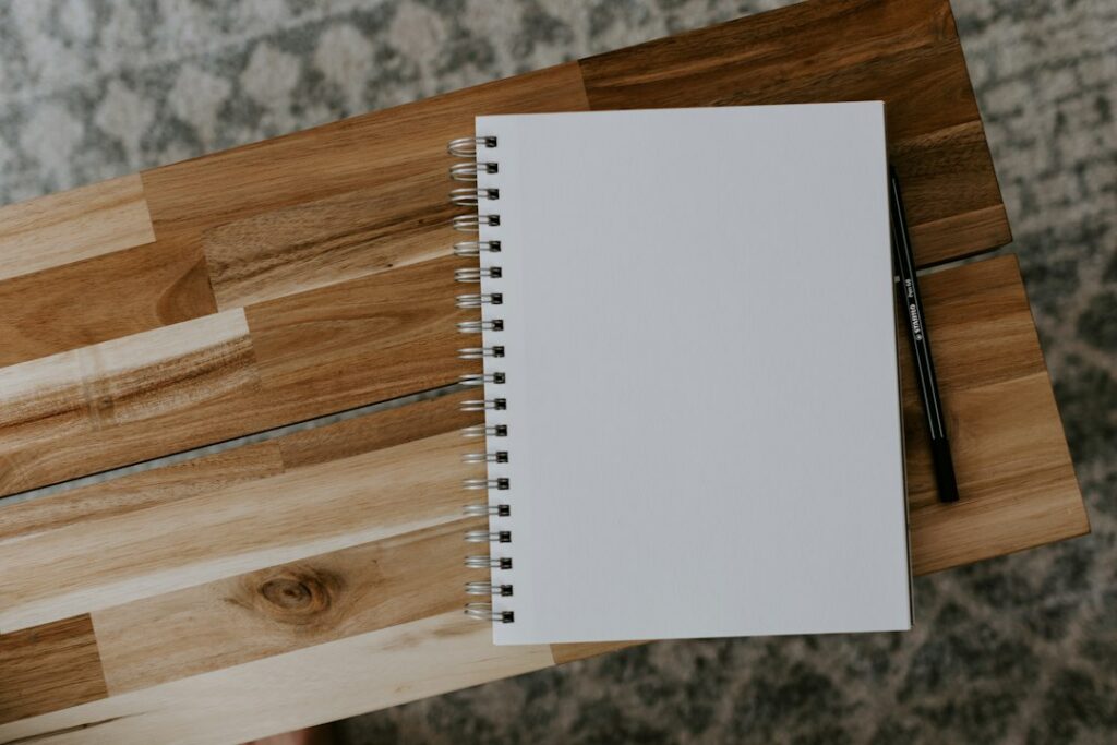 Paper planner and pen on a practical productivity desk