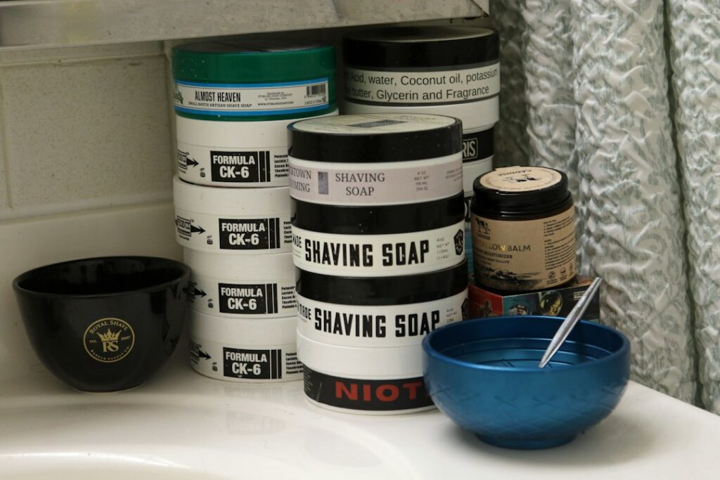 Men's moisturizer and skincare products on a clean counter