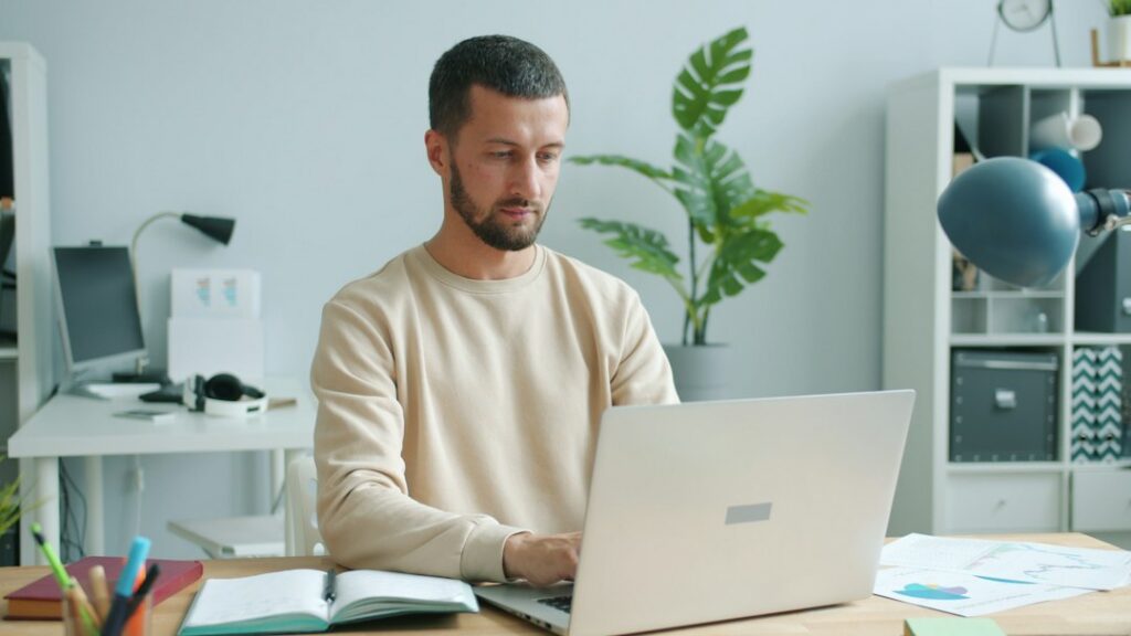 Man beginning focused work despite low motivation