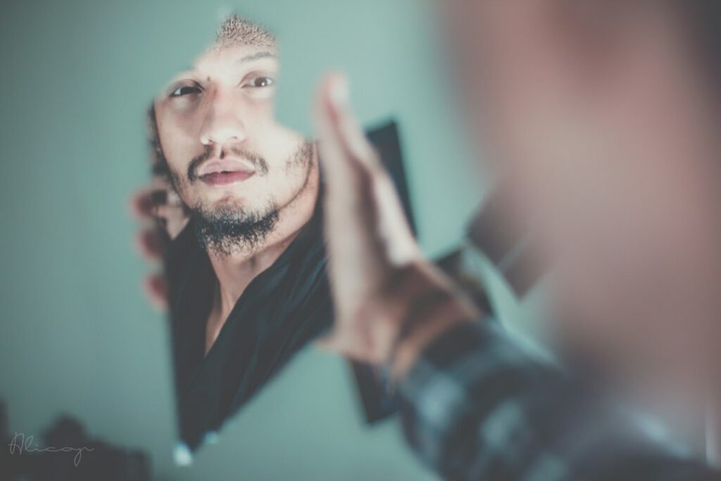 Man carefully trimming the neckline of his beard