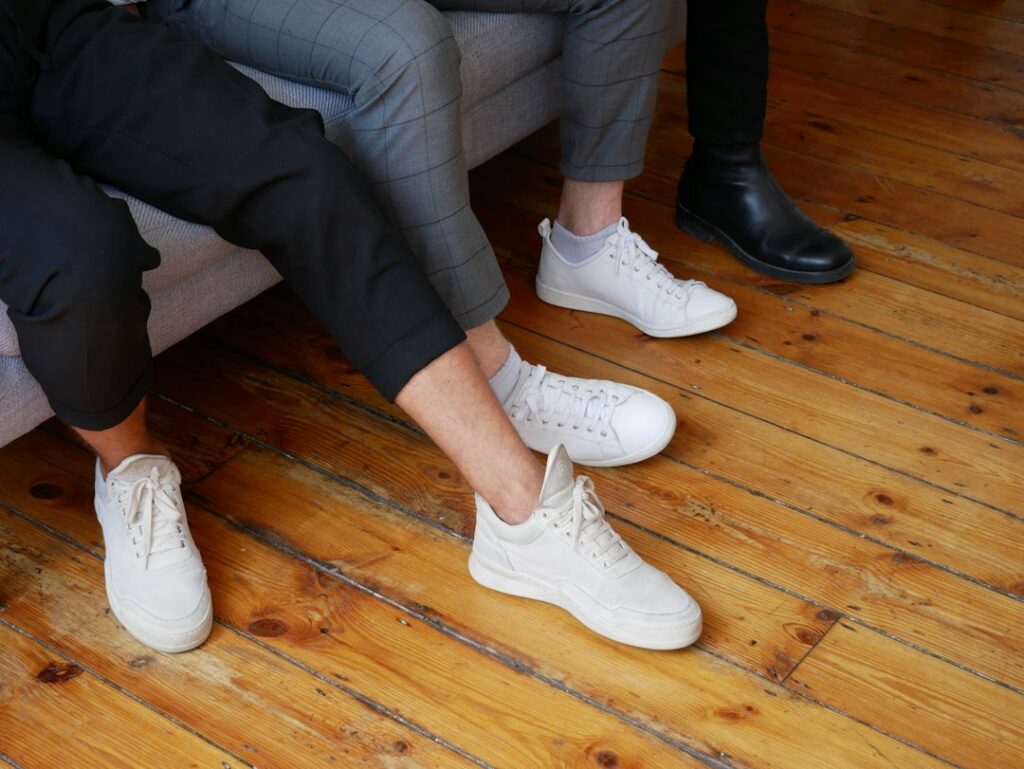 Loafers and white sneakers compared for smart casual outfits