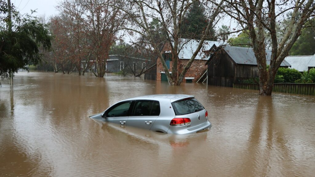 Car caught in floodwater in western Sydney