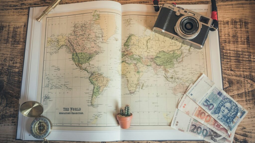 Map with compass and camera for travel planning
