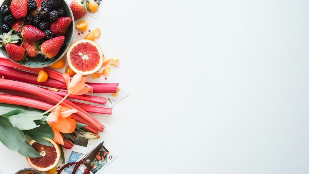 Fruit and food ingredients on a table for an editorial weight management review