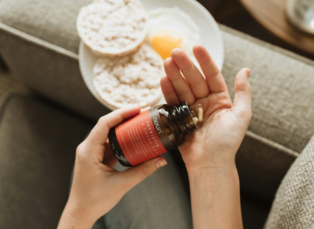 Nerve health supplement bottle and capsules on a neutral surface