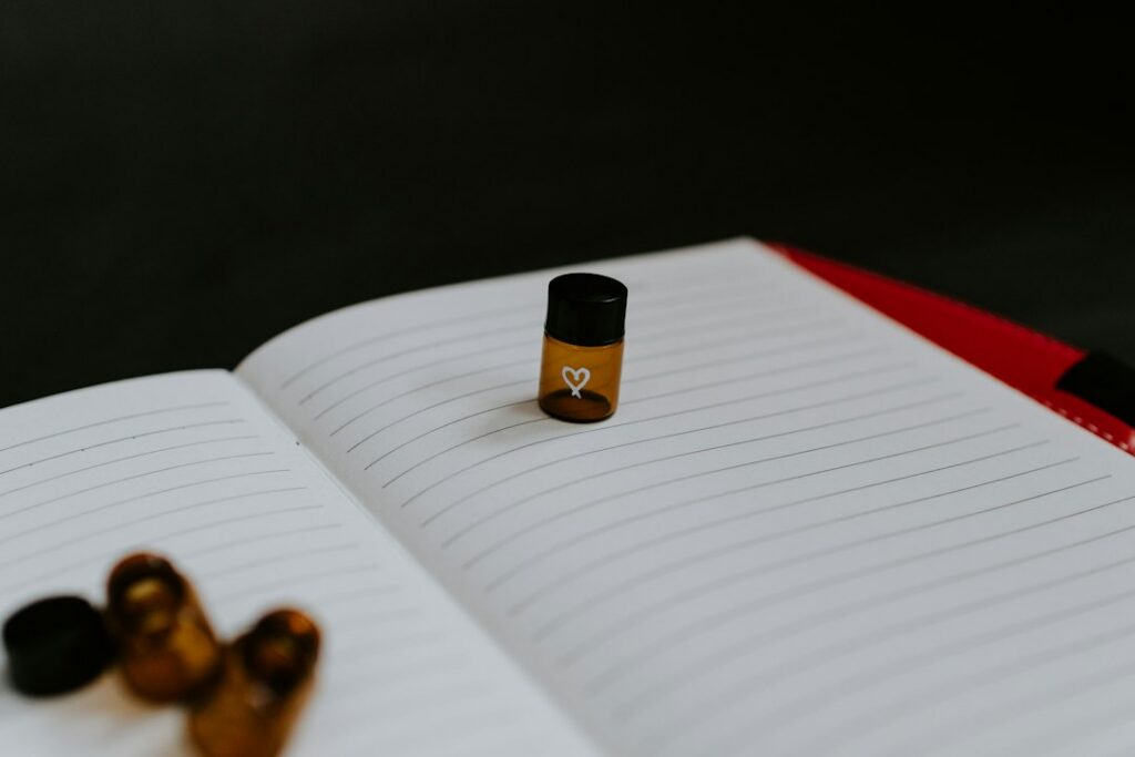 Brain supplement bottle and capsules beside a notebook