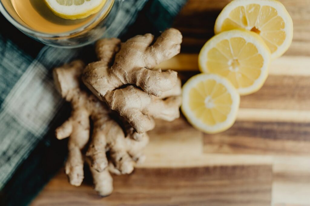 Wellness tonic drink with citrus and ginger in a kitchen