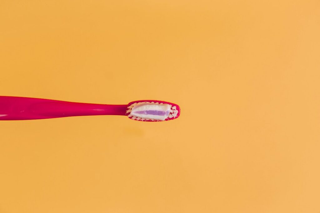 Dental probiotic capsules beside everyday oral care items