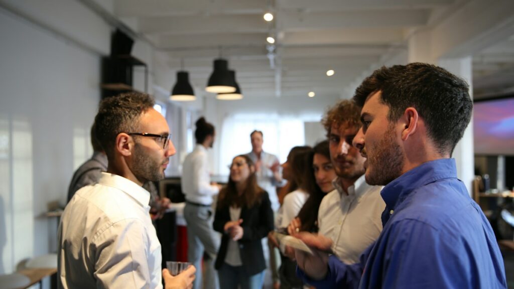 People speaking at a professional event