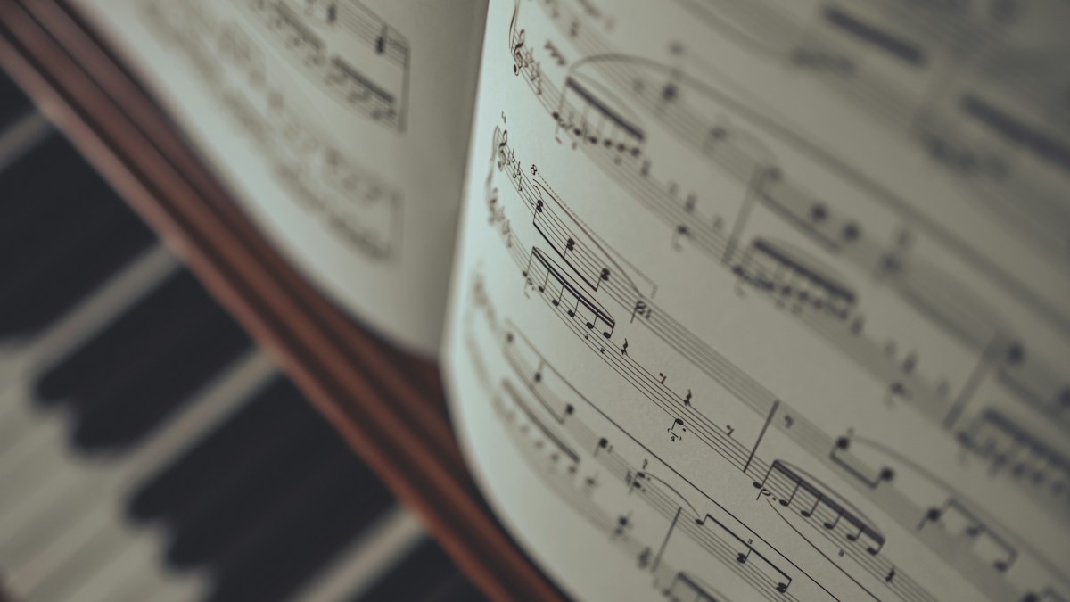 Open sheet music used for learning piano notation