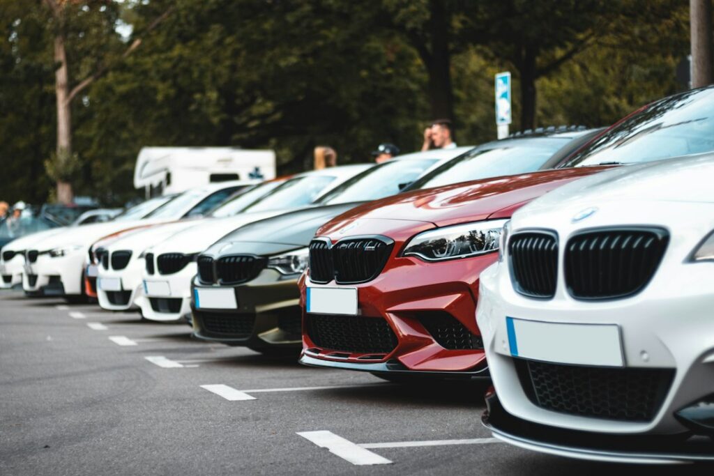 Rental car fleet parked in a lot