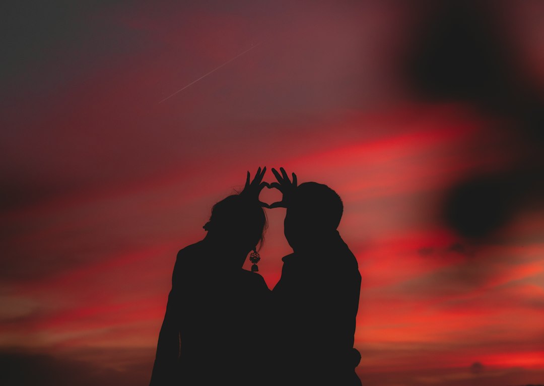Couple holding hands at sunset as relationship context for a Soulmate Sketch review
