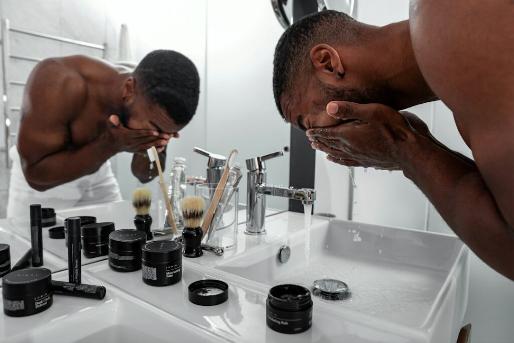 Men's skincare serum and cream arranged on a clean counter