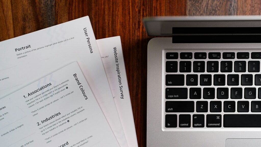 Vehicle history reports being compared beside a car