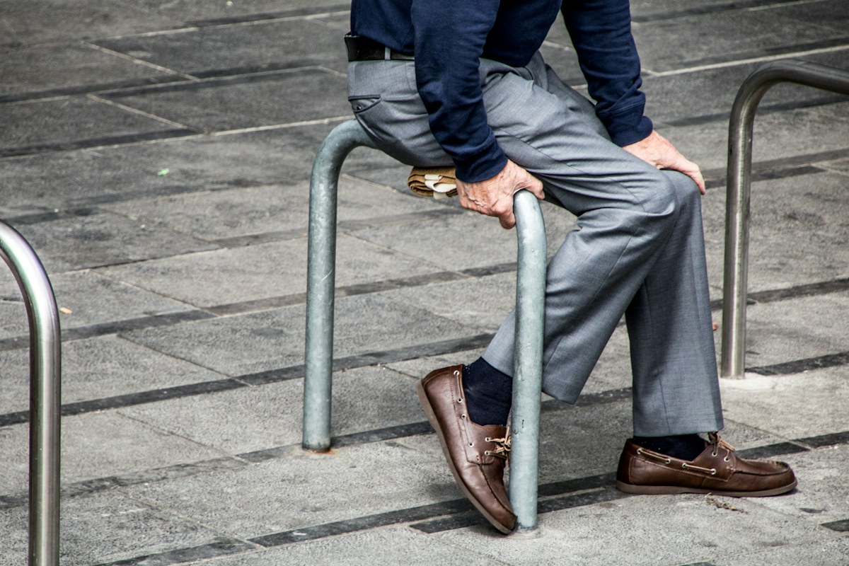 Man wearing relaxed professional clothing in an urban setting