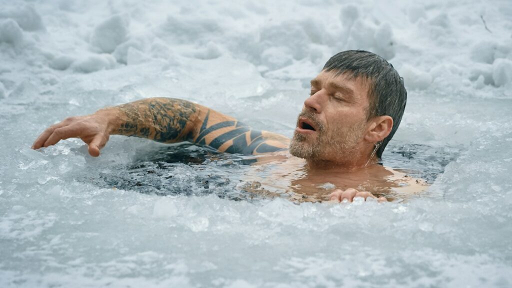 Man using cold water recovery outdoors
