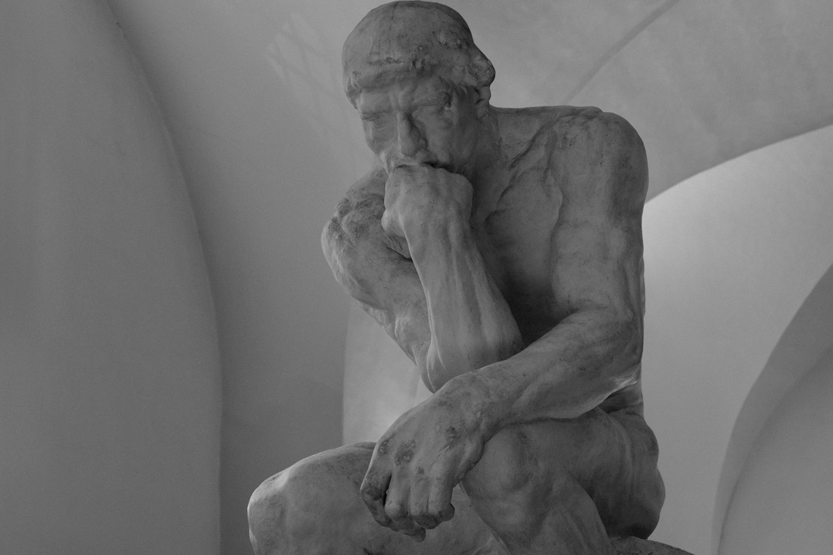 Classical statue representing deliberate thought and judgment