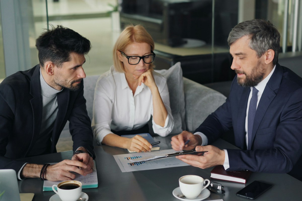 People discussing financial planning around a table