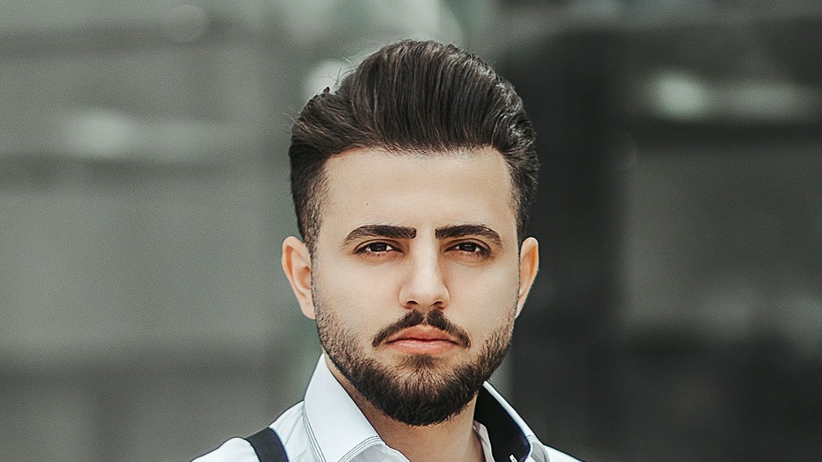 Close view of a man's eyebrows, hair and beard