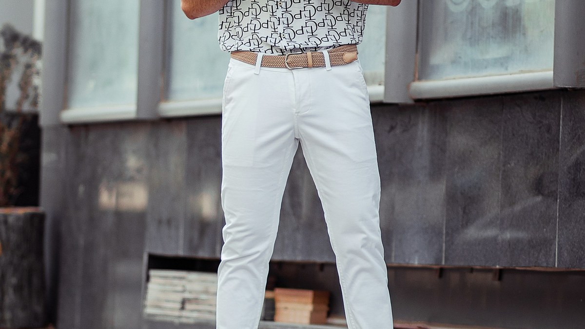 Tan leather belt worn with light trousers