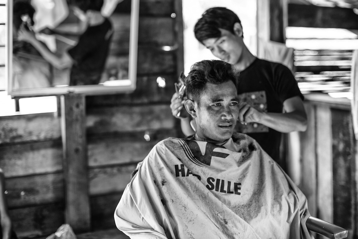 Man getting his hair cut as part of a regular grooming routine