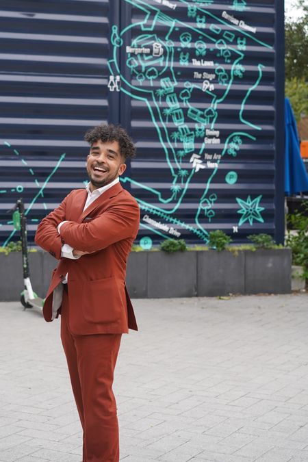 Man standing outdoors in a tailored suit showing the jacket’s body length