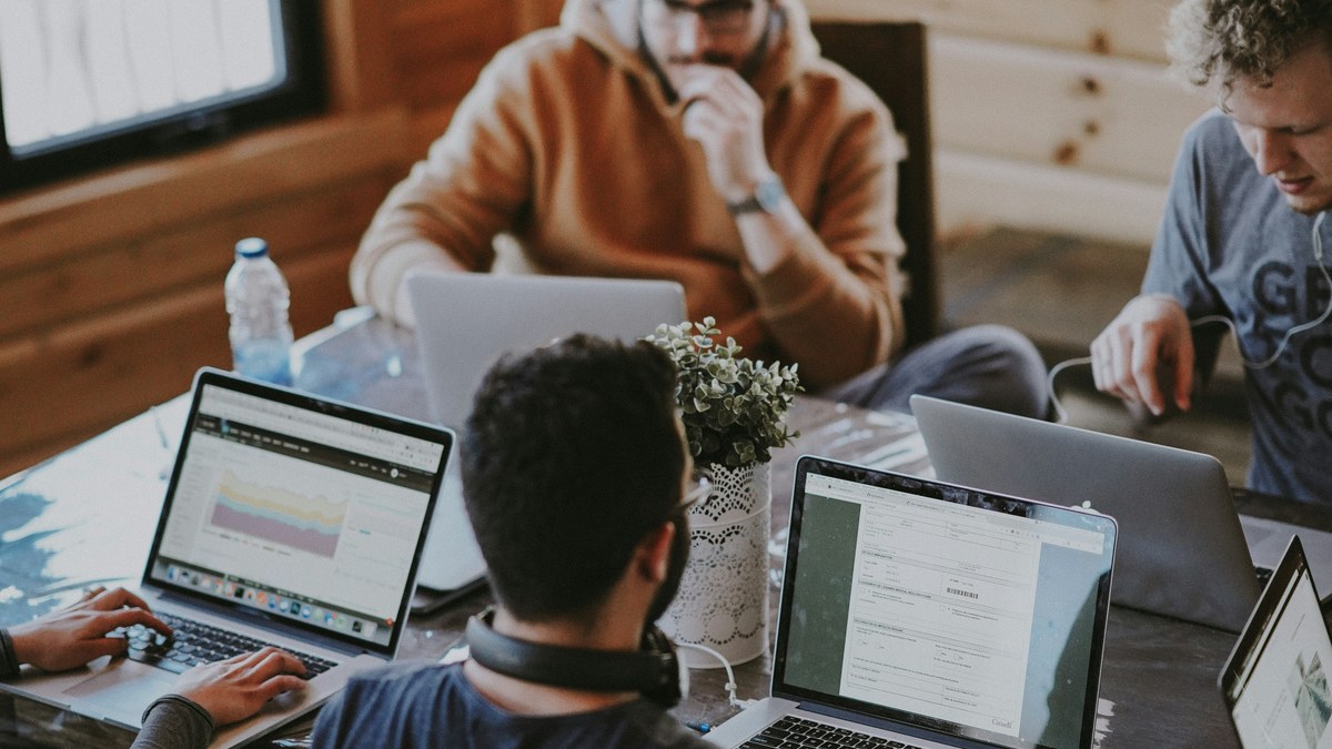 People working together around a shared office table