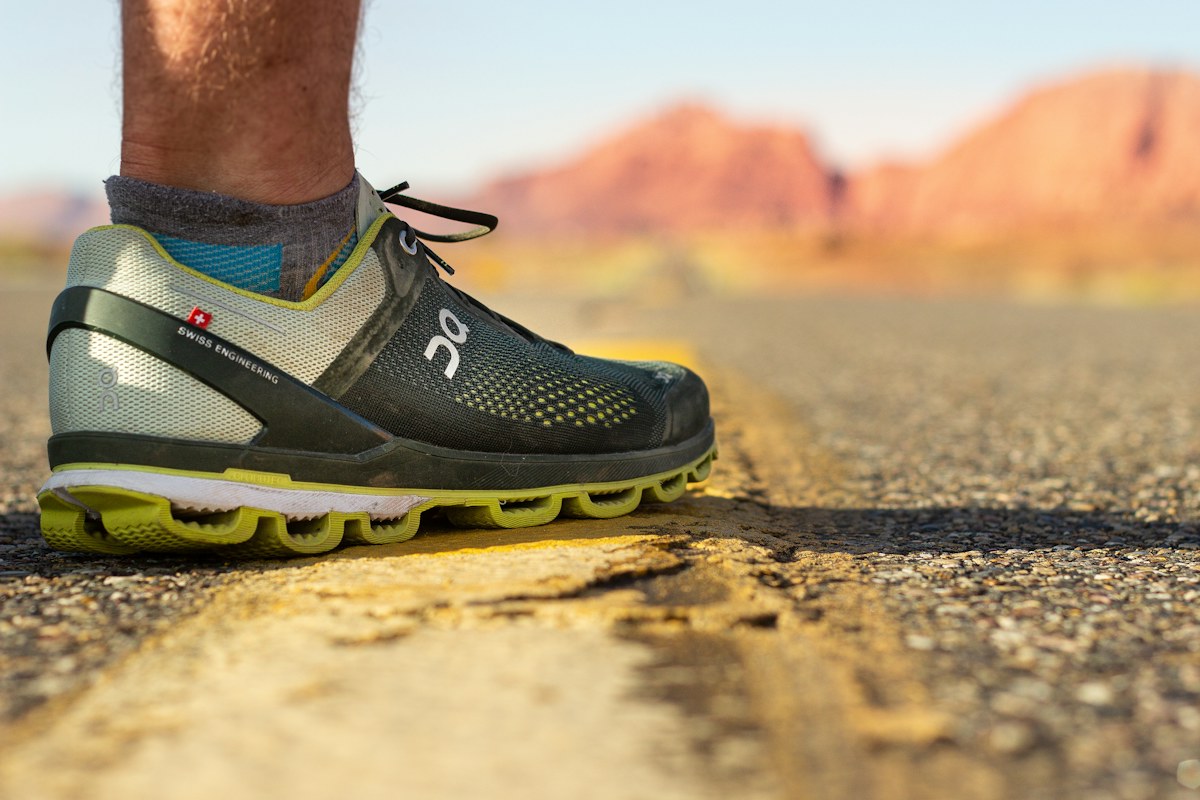 Close view of a running shoe on a road