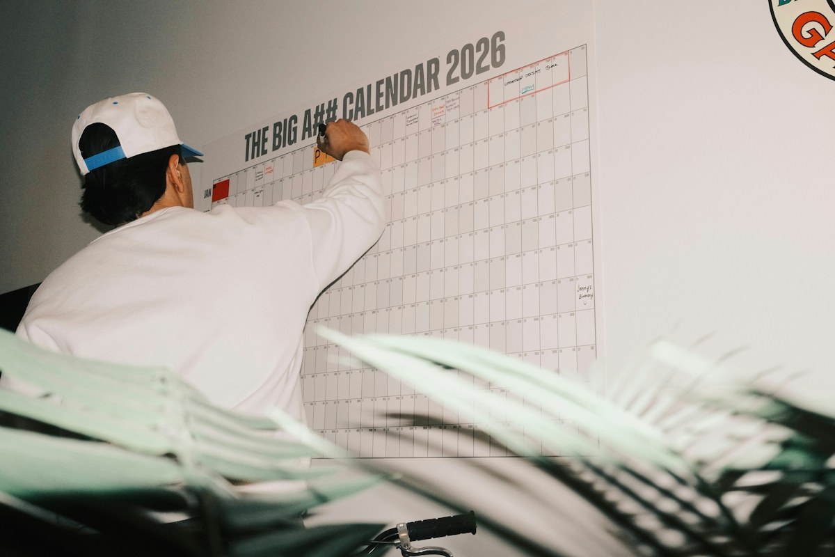 Man planning focused work at a desk