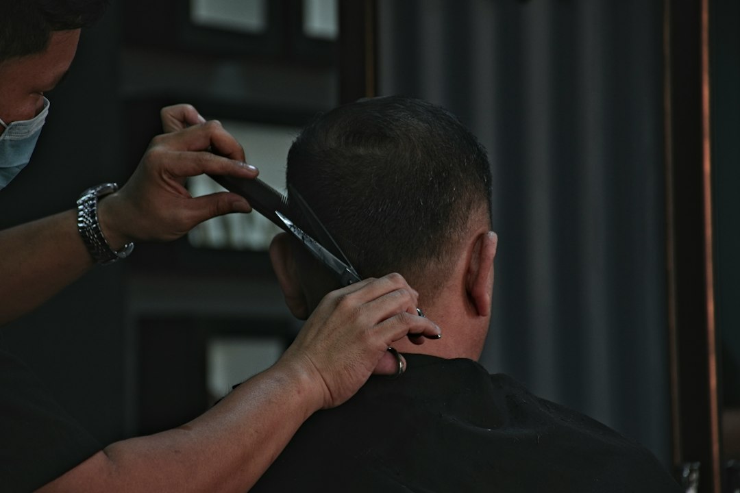 Man receiving a haircut in a barbershop