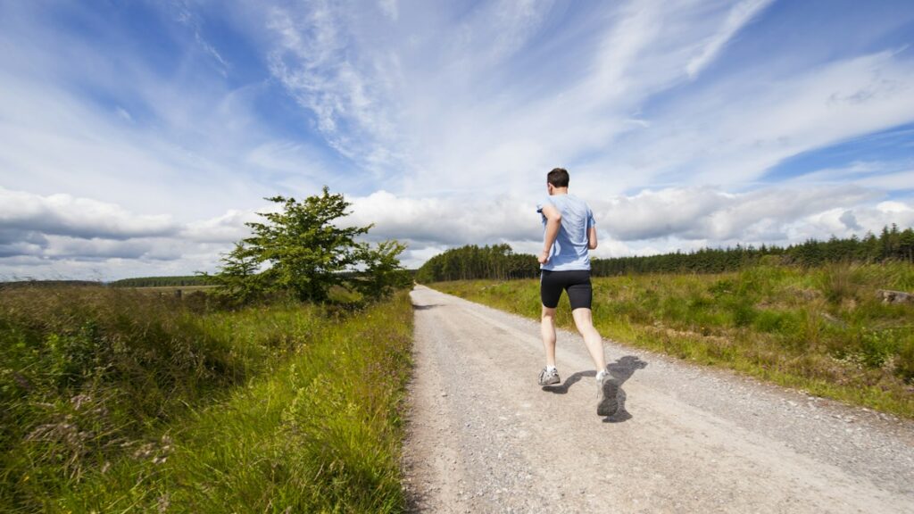 Man running outdoors on a trail