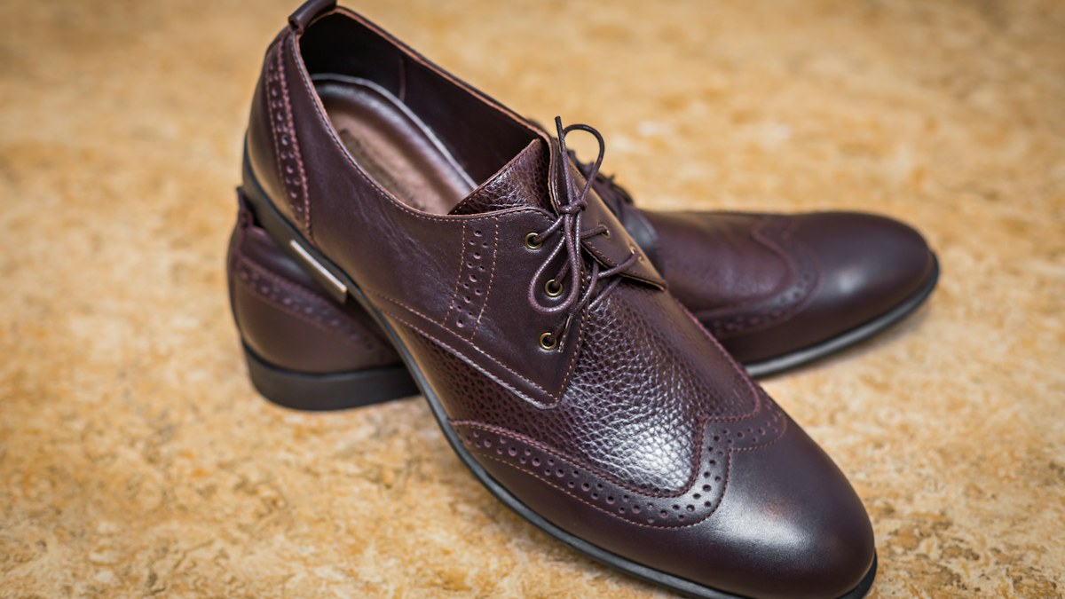 Close-up of men's brown leather brogues showing leather shade and finish