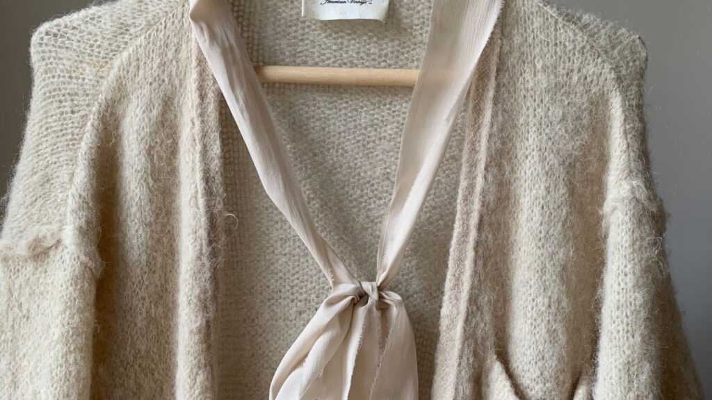 Cream ribbed knit sweater texture