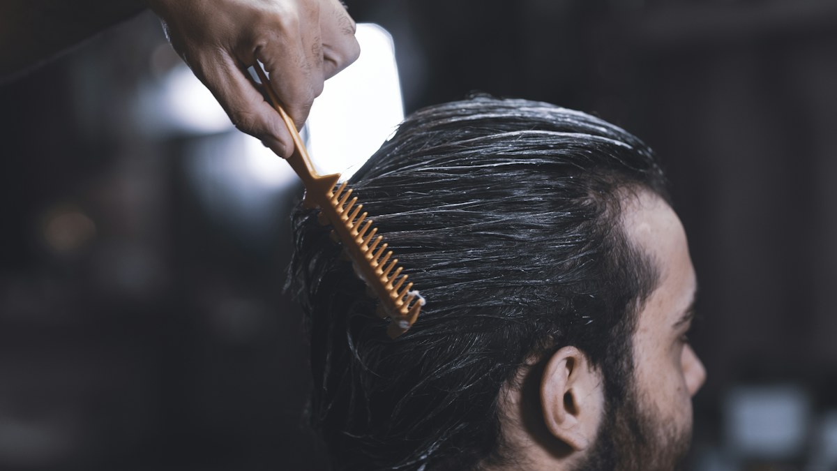 Man receiving a haircut in a barbershop