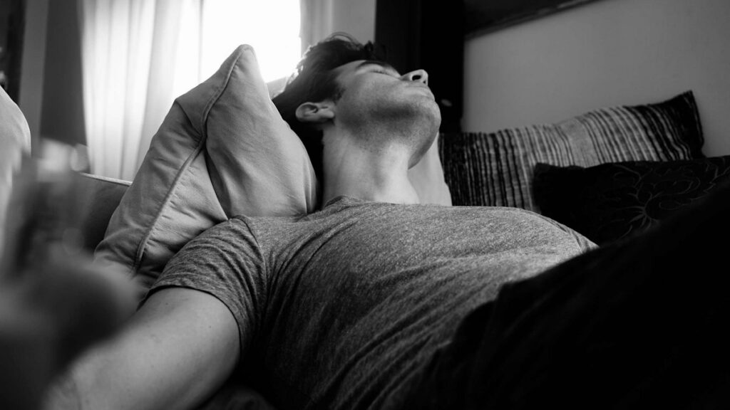 Man resting at night as part of a sleep routine