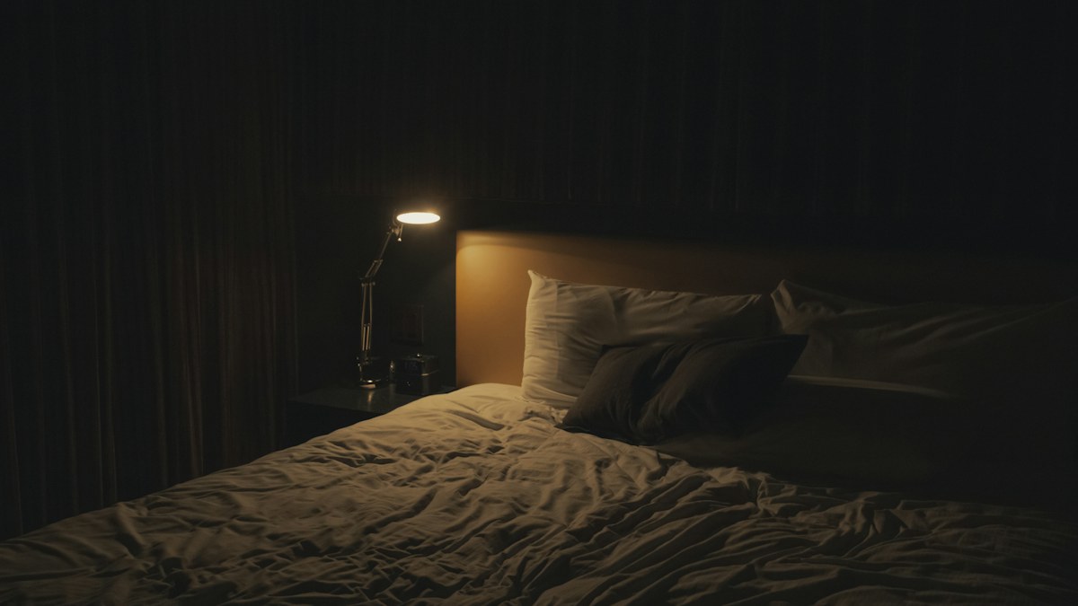 Nightstand and clock representing a consistent sleep schedule