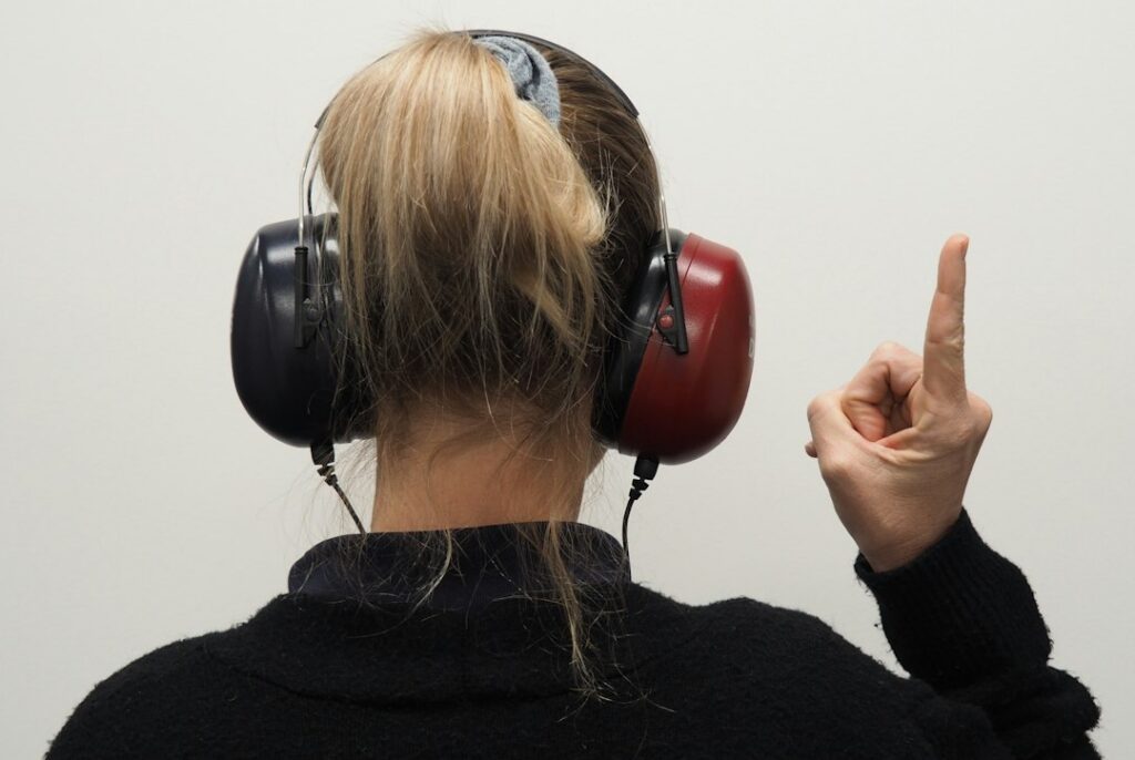 Adult completing a hearing test