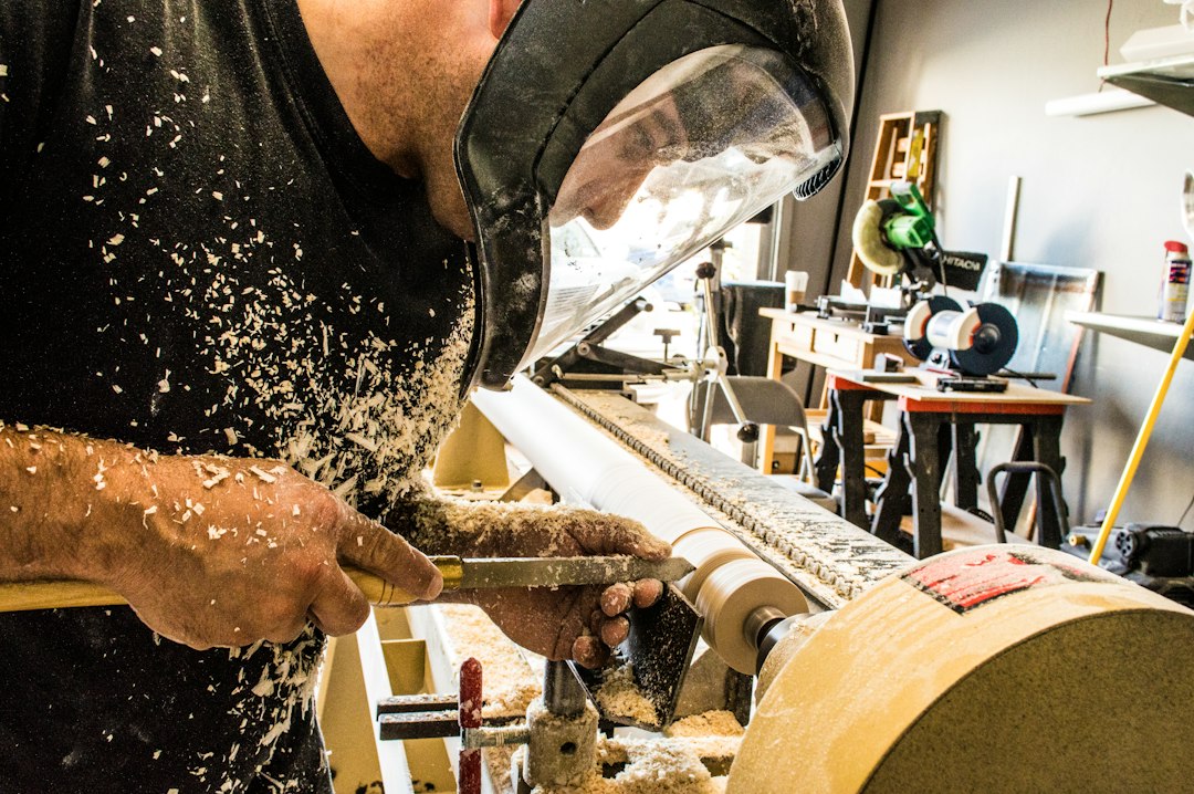 Man working in a workshop with hearing protection
