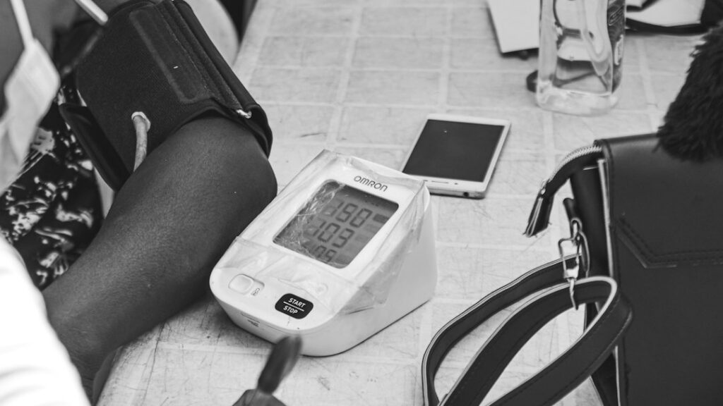 Digital blood pressure monitor checking an arm