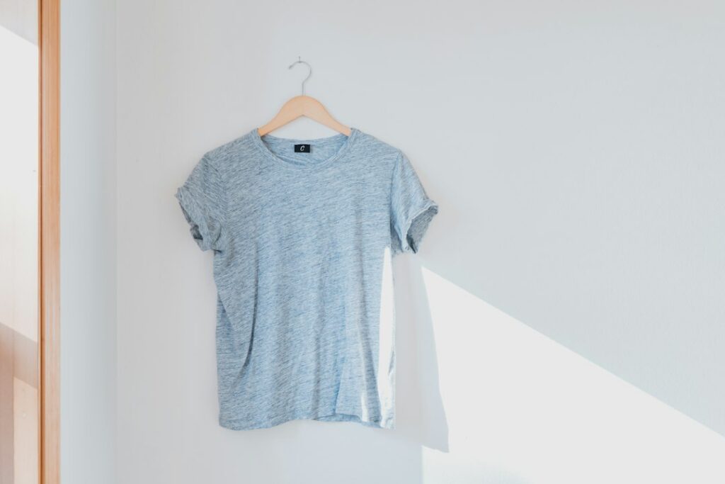 T-shirt hanging against a wall