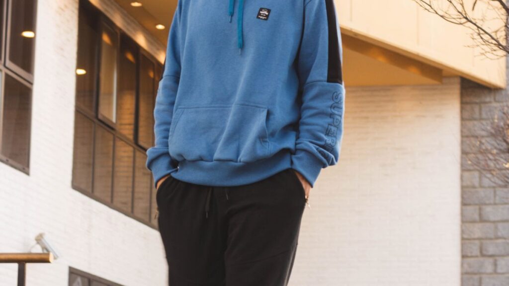 Man wearing a hoodie showing a practical men's hoodie fit