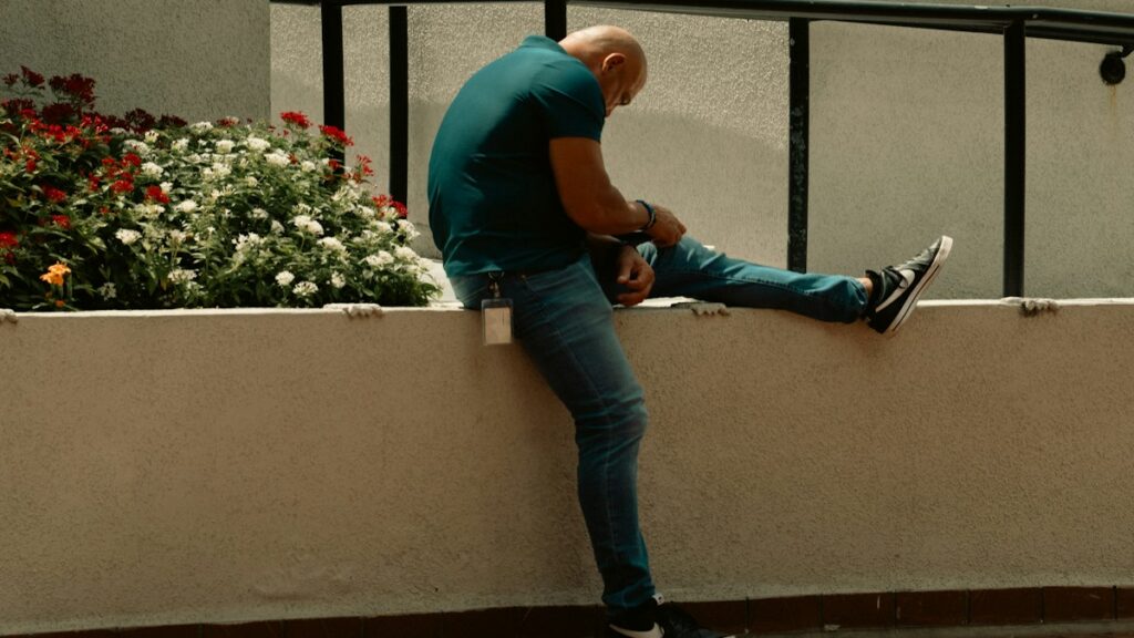 Man stretching his leg outdoors